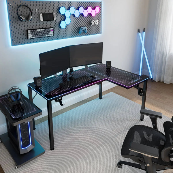 Modern gaming command center featuring the Eureka Ergonomic L-shaped glass desk with a dual monitor setup.