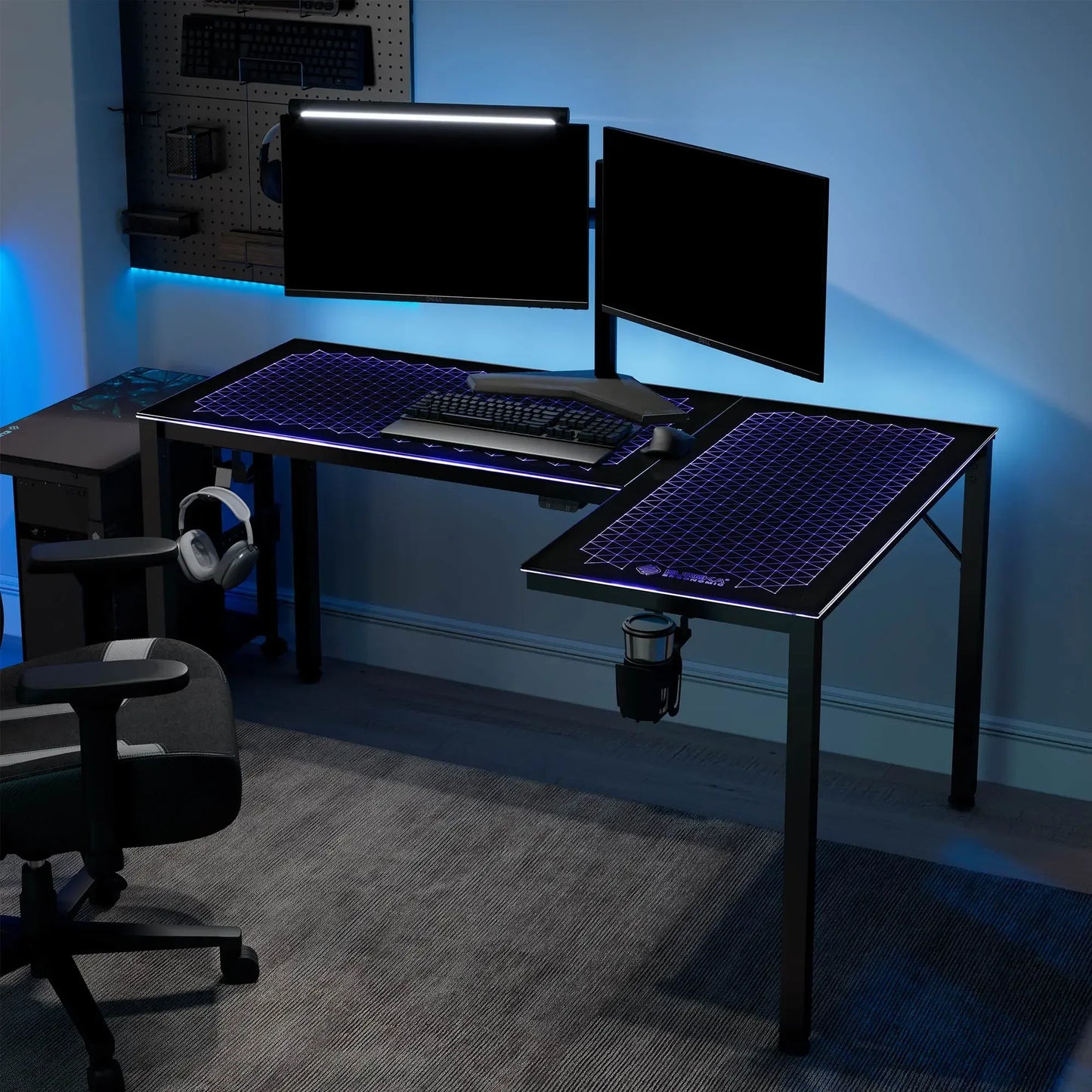 Modern gaming command center featuring the Eureka Ergonomic L-shaped glass desk with a dual monitor setup.
