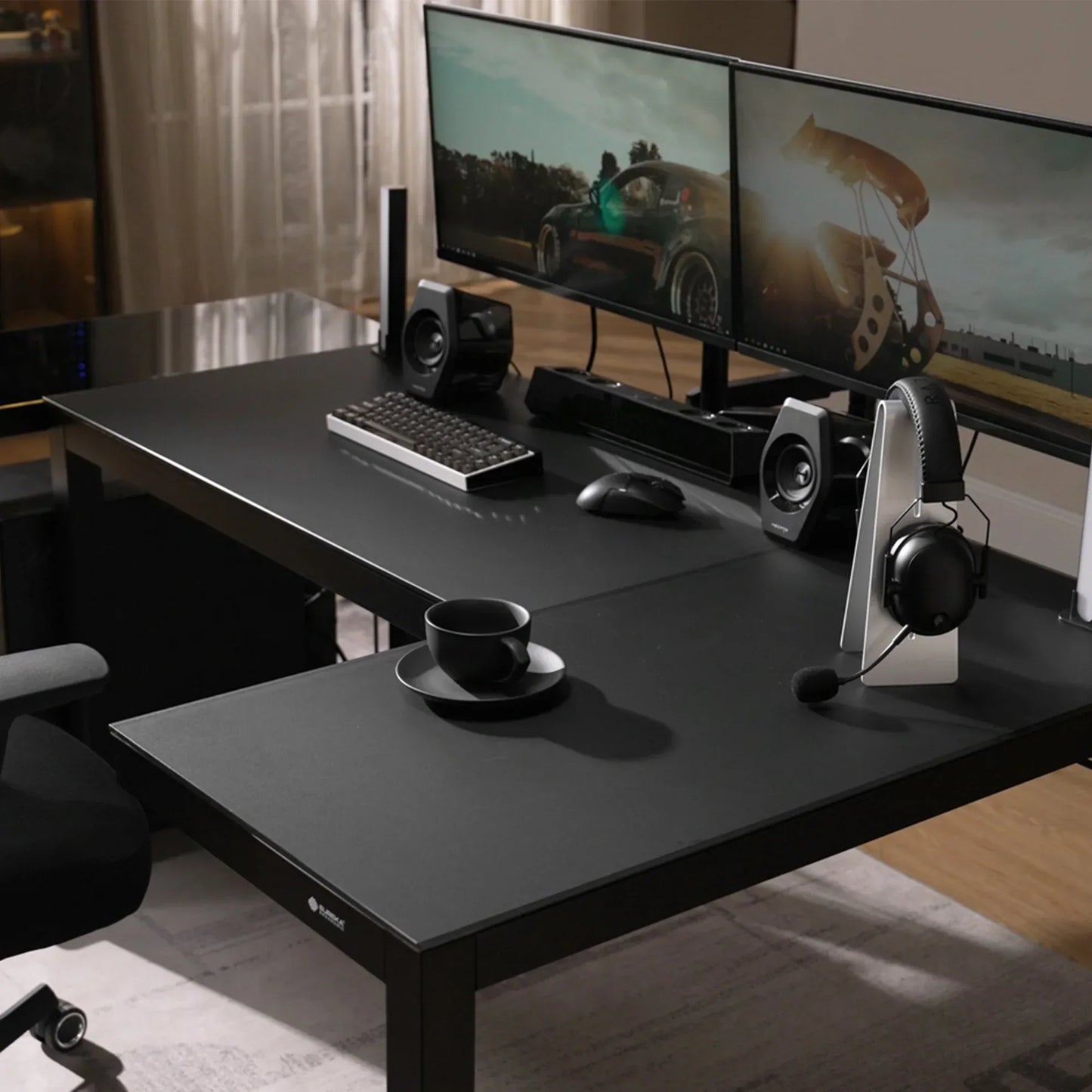 Modern gaming command center featuring the Eureka Ergonomic L-shaped glass desk with a dual monitor setup.