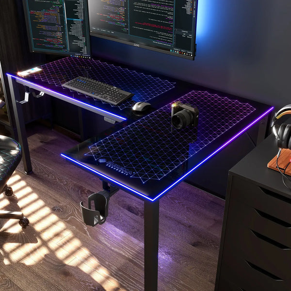 Modern gaming command center featuring the Eureka Ergonomic L-shaped glass desk with a dual monitor setup.