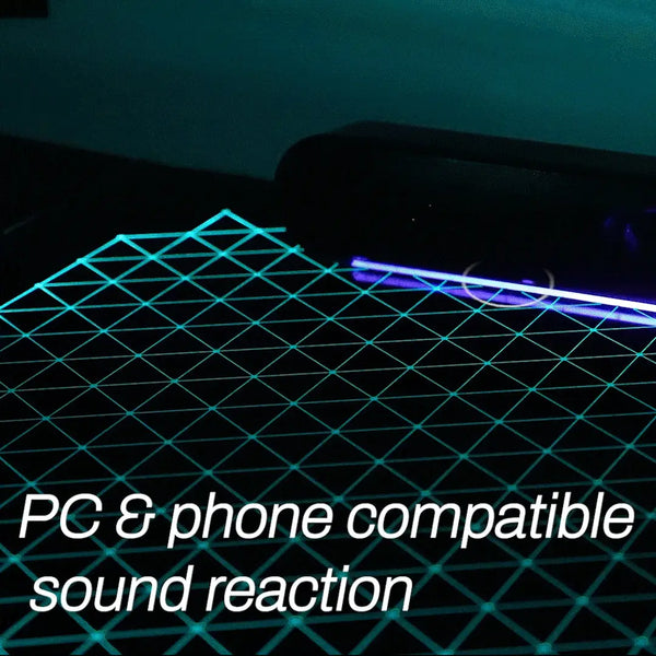 Close-up view of the premium tempered glass surface and integrated RGB light strips on the Eureka Ergonomic desk.